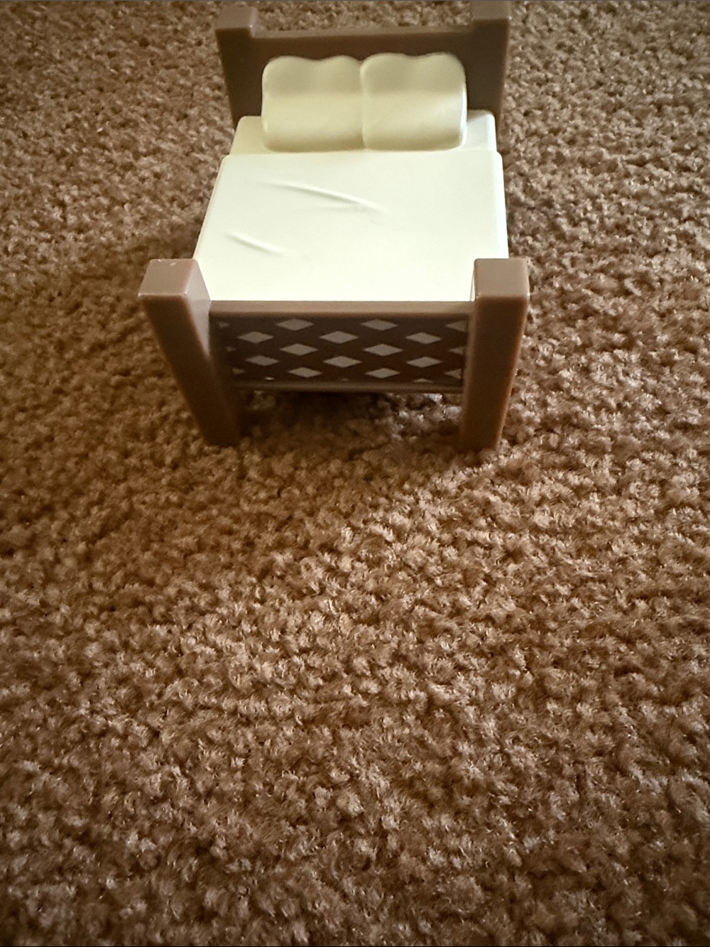 miniature toy bed from the Bluey Family Home Playset by Moose Toys